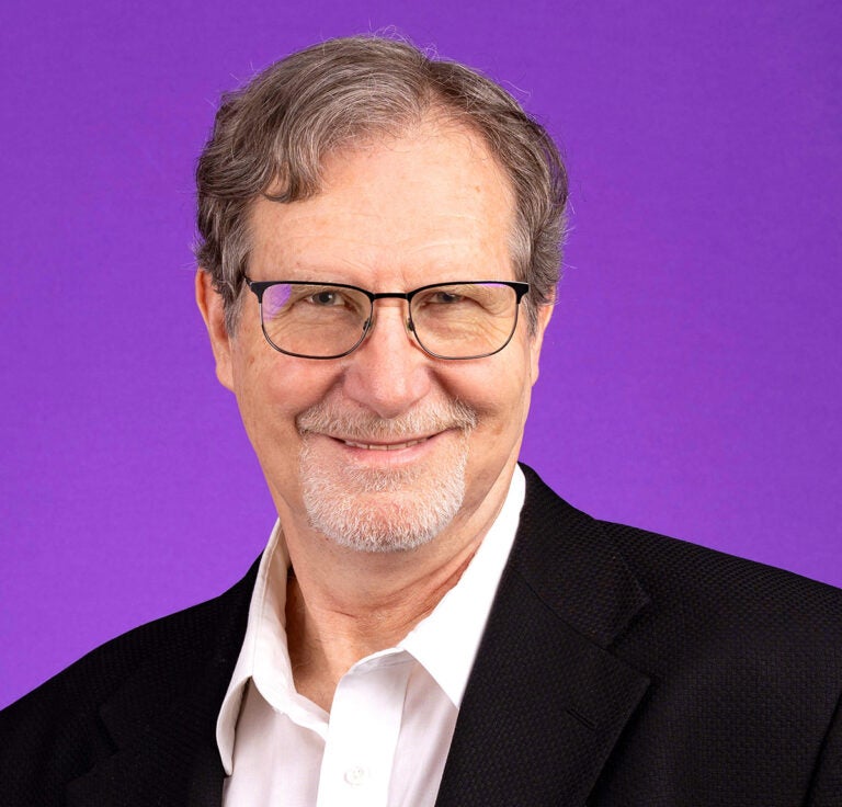 Dr. Calvin Mercer's ECU profile photo with purple background