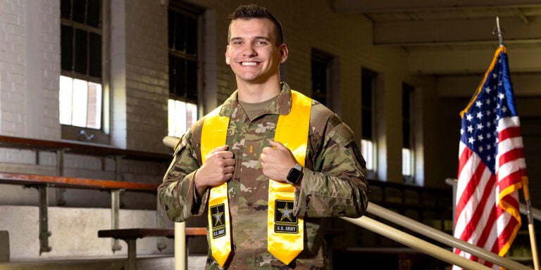 Brandon Damgaard wearing his military uniform and gold sash for the U.S. Army
