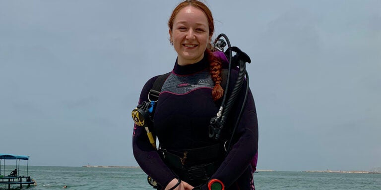 Katelyn Rollins in her scuba gear ready to dive at the Eastern Harbor in Egypt